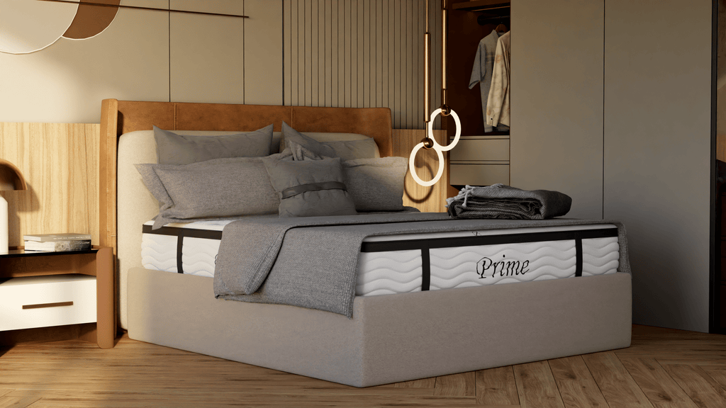 Bed with gray bedding and a visible 'Prime' mattress brand name in a bedroom setting.